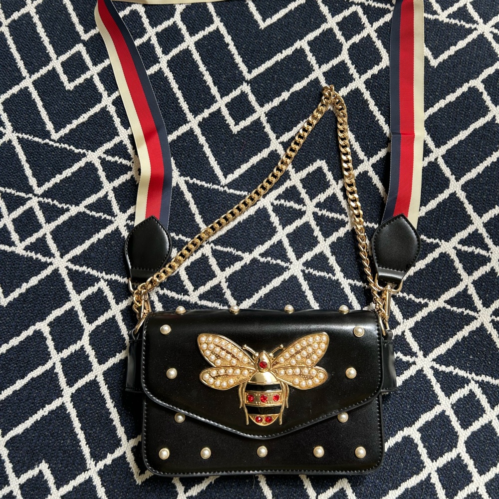 Elegant Black Designer Bag with Gold Accents